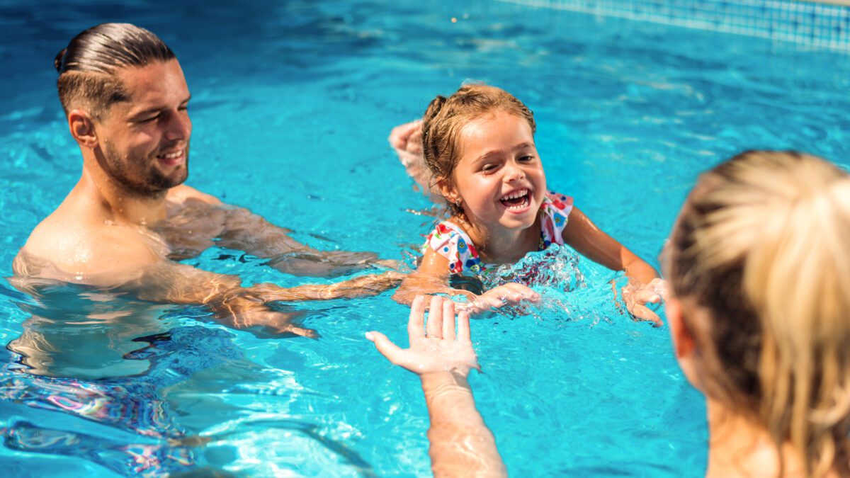 happy family in the pool